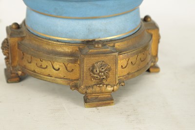 Lot 663 - A PAIR OF FRENCH LATE 19TH CENTURY CERAMIC AND GILT BRASS OIL LAMP BASES