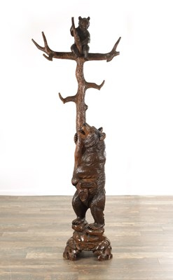 Lot 1219 - A GOOD 19TH CENTURY CARVED LINDEN WOOD BLACK FOREST BEAR HAT AND COAT STAND