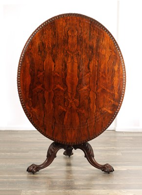 Lot 1391 - GILLOWS LANCASTER. A MID 19TH CENTURY FIGURED ROSEWOOD OVAL TILT TOP BREAKFAST TABLE