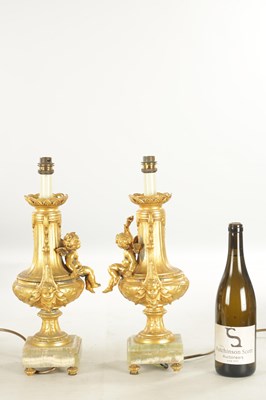 Lot 730 - A PAIR OF EARLY 20TH CENTURY FRENCH GILT METAL AND GREEN ONYX ELECTRIFIED TABLE LAMPS