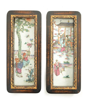 Lot 191 - A PAIR OF 19TH CENTURY CANTONESE FAMILLE ROSE HANGING PLAQUES