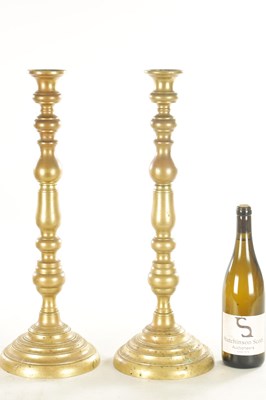 Lot 880 - A LARGE PAIR OF 20TH CENTURY BRASS TABLE LAMPS / CANDLESTICKS