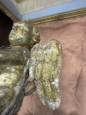 Lot 1182 - A 17TH CENTURY CONTINENTAL GILT-GESSO CARVED CHERUB