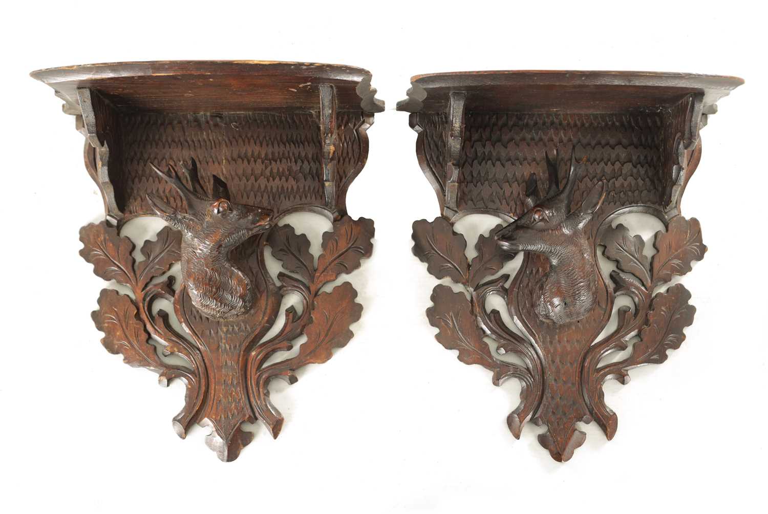 Lot 1178 - A PAIR OF LATE 19TH CENTURY BLACK FOREST HANGING WALL BRACKETS