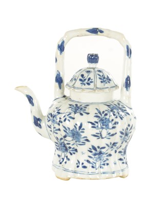 Lot 231 - AN EARLY CHINESE BLUE AND WHITE TEAPOT BEARING KANGXI MARK BENEATH