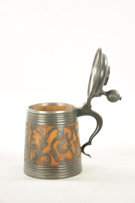 Lot 653 - A 19TH CENTURY SWEDISH COMMEMORATIVE OAK AND PEWTER TANKARD