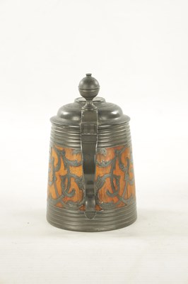 Lot 653 - A 19TH CENTURY SWEDISH COMMEMORATIVE OAK AND PEWTER TANKARD