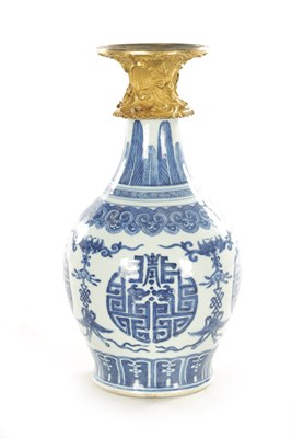 Lot 125 - AN 18TH CENTURY CHINESE BLUE AND WHITE BULBOUS VASE WITH CAST ORMOLU NECK MOUNT