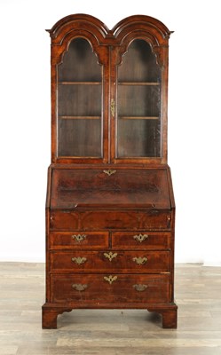 Lot 1397 - A WILLIAM AND MARY FIGURED WALNUT DOUBLE DOME TOP BUREAU BOOKCASE OF SMALL SIZE