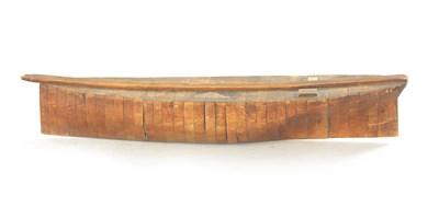 Lot 872 - A 19TH CENTURY SEGMENTED WOODEN MODEL OF A BOAT