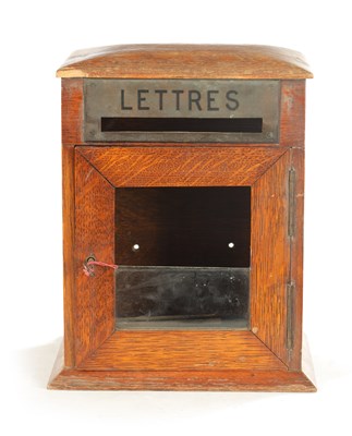 Lot 1211 - AN EARLY 20TH CENTURY COUNTRY HOUSE OAK LETTER BOX