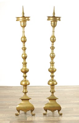 Lot 887 - A GOOD PAIR OF MID 18TH CENTURY BRASS STANDING PRICKET STICKS