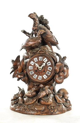 Lot 1010 - A 19TH CENTURY BLACK FOREST CARVED LINDEN WOOD MANTEL CLOCK