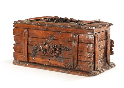 Lot 1207 - A 19TH CENTURY BLACK FOREST CARVED LINDEN WOOD HUMIDOR