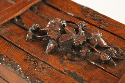 Lot 1207 - A 19TH CENTURY BLACK FOREST CARVED LINDEN WOOD HUMIDOR