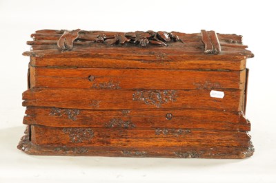 Lot 1207 - A 19TH CENTURY BLACK FOREST CARVED LINDEN WOOD HUMIDOR