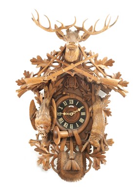 Lot 1037 - AN IMPRESSIVE 19TH CENTURY BLACK FOREST CARVED LINDEN WOOD HANGING COOKOO CLOCK