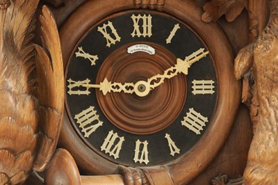 Lot 1037 - AN IMPRESSIVE 19TH CENTURY BLACK FOREST CARVED LINDEN WOOD HANGING COOKOO CLOCK