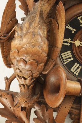 Lot 1037 - AN IMPRESSIVE 19TH CENTURY BLACK FOREST CARVED LINDEN WOOD HANGING COOKOO CLOCK