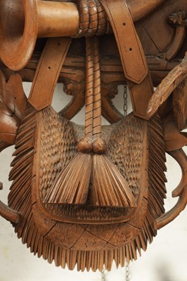 Lot 1037 - AN IMPRESSIVE 19TH CENTURY BLACK FOREST CARVED LINDEN WOOD HANGING COOKOO CLOCK