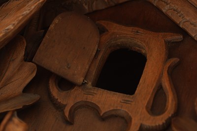 Lot 1037 - AN IMPRESSIVE 19TH CENTURY BLACK FOREST CARVED LINDEN WOOD HANGING COOKOO CLOCK