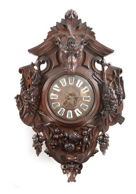 Lot 1105 - A 19TH CENTURY BLACK FOREST CARVED OAK HANGING WALL CLOCK