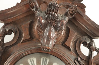 Lot 1105 - A 19TH CENTURY BLACK FOREST CARVED OAK HANGING WALL CLOCK