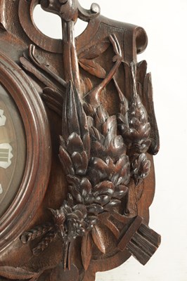 Lot 1105 - A 19TH CENTURY BLACK FOREST CARVED OAK HANGING WALL CLOCK