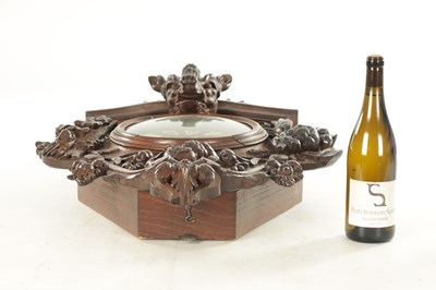 Lot 1105 - A 19TH CENTURY BLACK FOREST CARVED OAK HANGING WALL CLOCK