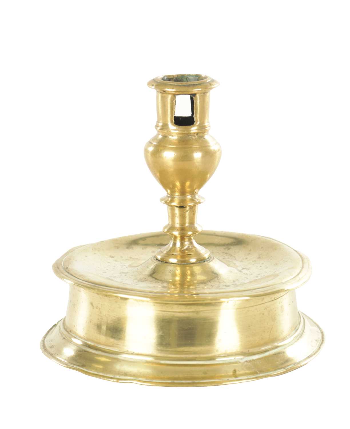 Lot 874 - A RARE 17TH CENTURY BELL BASE / CAPSTAN BRASS CANDLESTICK