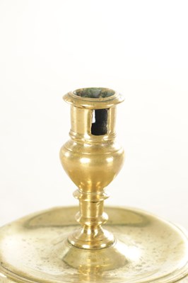 Lot 874 - A RARE 17TH CENTURY BELL BASE / CAPSTAN BRASS CANDLESTICK