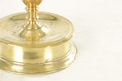 Lot 874 - A RARE 17TH CENTURY BELL BASE / CAPSTAN BRASS CANDLESTICK