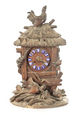 Lot 1079 - A LATE 19TH BLACK FOREST CARVED LINDEN WOOD MANTEL CLOCK