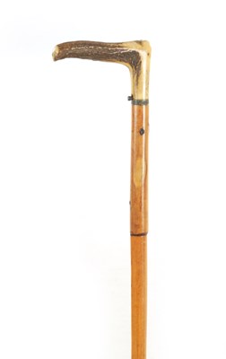 Lot 457 - A 19TH CENTURY MALACCA AND STAG HORN POACHER'S GUN / WALKING STICK