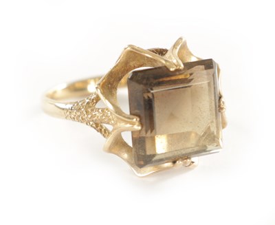 Lot 254 - A LARGE 9CT GOLD SMOKEY QUARTZ RING