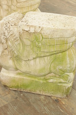 Lot 840 - A PAIR OF CARVED LIMESTONE WINGED LIONS