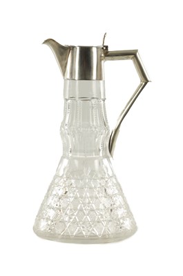 Lot 400 - A SILVER TOPPED CUT GLASS CLARET JUG