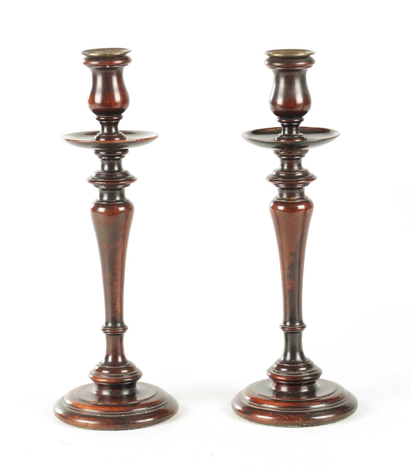 Lot 899 - A PAIR OF GEORGE III TURNED MAHOGANY CANDLESTICKS