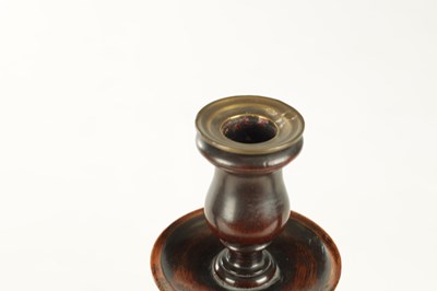 Lot 899 - A PAIR OF GEORGE III TURNED MAHOGANY CANDLESTICKS