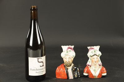 Lot 63 - A PAIR OF 19TH CENTURY FIGURAL STAFFORDSHIRE VASES