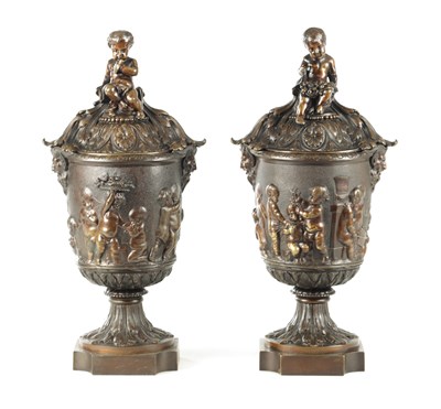 Lot AFTER CLODIAN. A PAIR OF LATE 19TH CENTURY BRONZE LIDDED URNS