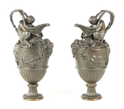 Lot A PAIR OF LATE 19TH CENTURY BRONZE EWERS OF CLASSICAL FORM