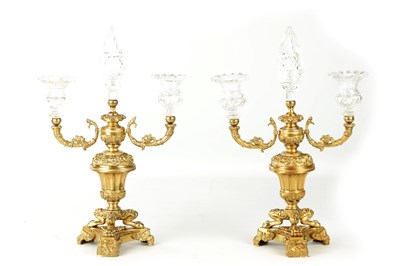 Lot A PAIR OF LATE 19TH CENTURY REGENCY STYLE FRENCH ORMOLU AND CUT GLASS CANDELABRA