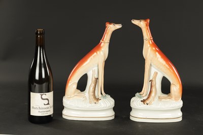 Lot 99 - A GOOD PAIR OF 19TH CENTURY STAFFORDSHIRE GREY HOUNDS