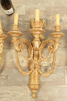 Lot 696 - A SET OF FOUR CARVED GILTWOOD ADAM STYLE HANGING WALL LIGHTS