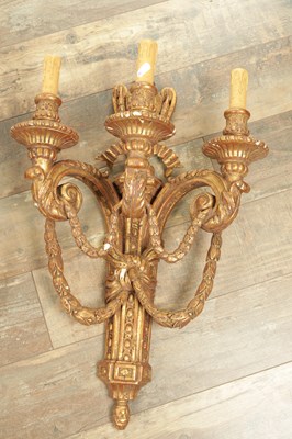 Lot 696 - A SET OF FOUR CARVED GILTWOOD ADAM STYLE HANGING WALL LIGHTS