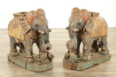 Lot 171 - A LARGE PAIR OF 19TH CENTURY INDIAN CARVED POLYCHROME PAINTED SCULPTURES OF ELEPHANTS