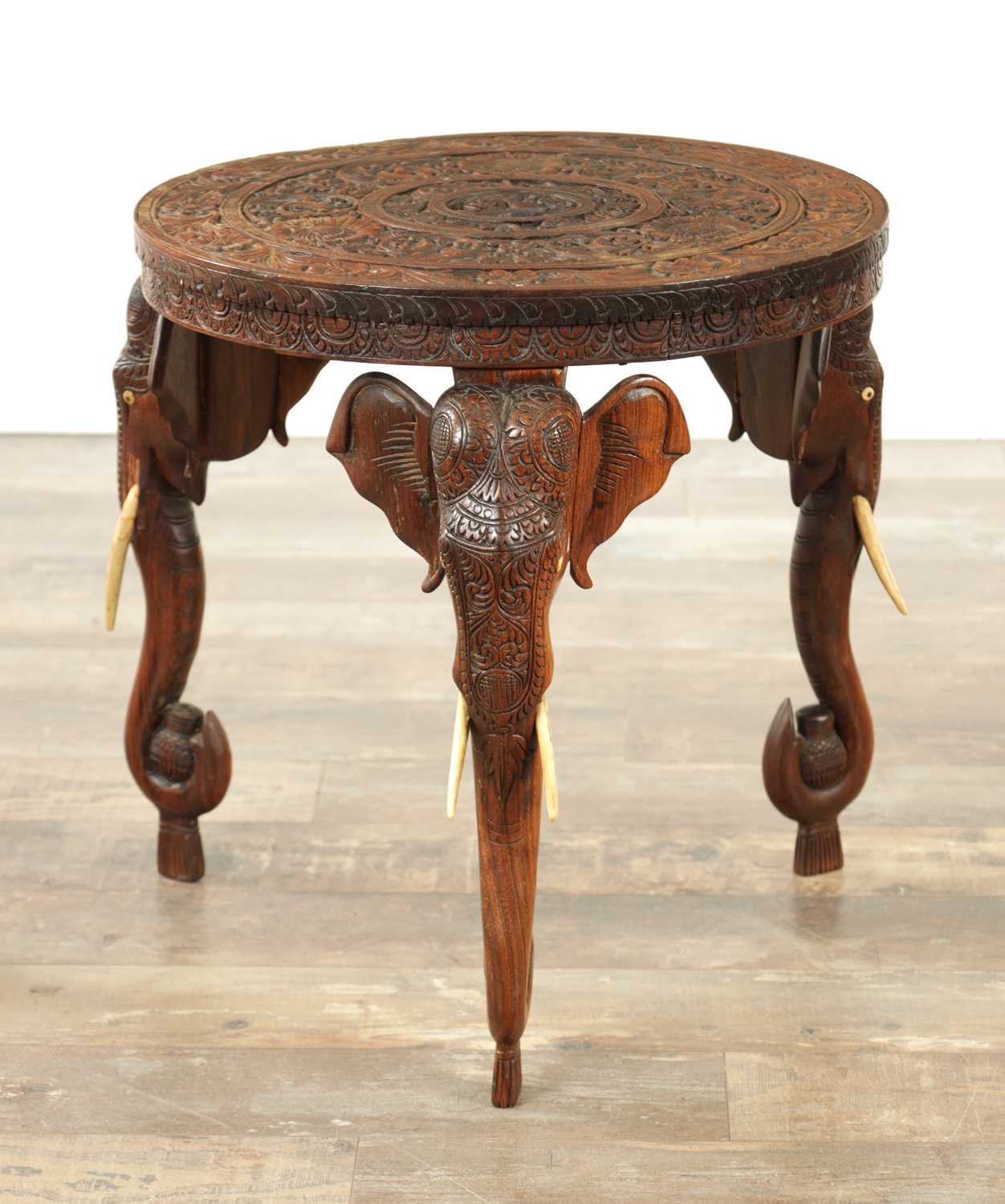 Lot 245 - A 19TH CENTURY INDIAN CARVED HARDWOOD OCCASIONAL TABLE