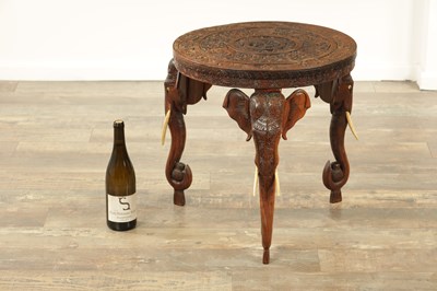 Lot 245 - A 19TH CENTURY INDIAN CARVED HARDWOOD OCCASIONAL TABLE