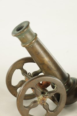 Lot 607 - A 19TH CENTURY BRONZE MODEL OF A STARTER CANNON